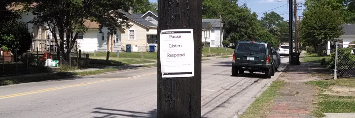 A listening point in a nearby residential neighborhood along a busy street